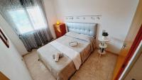 A bed or beds in a room at Apartamentos Navarra 07 Salou