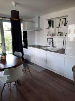 Kuchyňa alebo kuchynka v ubytovaní Superbe appartement climatisé au centre ville 777