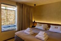 Posteľ alebo postele v izbe v ubytovaní Amantes Villas and Suites