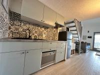 Kuchyňa alebo kuchynka v ubytovaní Appartement Duplex 4pers Climatisé - Locations VLD Camargue