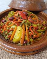a bowl of food with carrots and other vegetables at Erg Chigaga Regency Camp in El Gouera