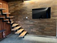Televízia a/alebo spoločenská miestnosť v ubytovaní Atelier Houses