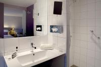 a white bathroom with a sink and a shower at Best Western Hotel de la Breche in Niort