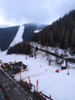 a ski slope with snow and a ski lodge at Studio Azur Mercantour in Valdeblore