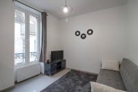 Televízia a/alebo spoločenská miestnosť v ubytovaní Appartement centre-ville