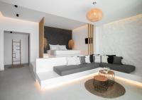 A bed or beds in a room at Seanfinity Beachfront Suites