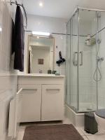 a bathroom with a shower and a sink and a toilet at Duplex Raphael- Wi-fi et parking privé in Toulon