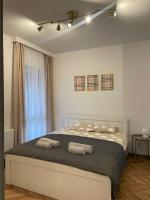 Posteľ alebo postele v izbe v ubytovaní Apartament przy Karmelu