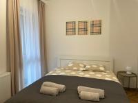 Posteľ alebo postele v izbe v ubytovaní Apartament przy Karmelu
