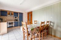 a kitchen with a table and chairs in a room at Maison de 3 chambres avec jardin clos et wifi a Dabo in Dabo