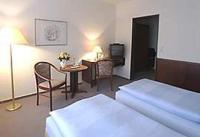 Postel nebo postele na pokoji v ubytování Stadthotel Oldenburg