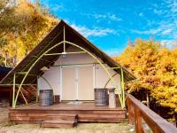 a gazebo with two trash cans on a deck at 見晴花園山莊Sunshine Villa in Ren&#39;ai