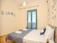Posteľ alebo postele v izbe v ubytovaní Beach Villa Evgenia with private pool by DadoVillas
