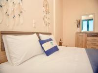 Posteľ alebo postele v izbe v ubytovaní Beach Villa Evgenia with private pool by DadoVillas