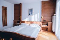 A bed or beds in a room at Landhaus Kreuz