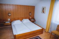 A bed or beds in a room at Landhaus Kreuz