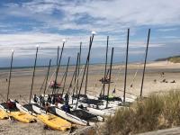 a bunch of boats are lined up on a beach at Appartement A confortable et lumineux in Neufchâtel-Hardelot