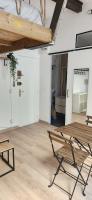 an empty room with a bench and a table at Studio au coeur de Marseille in Marseille