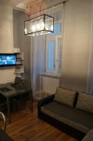 Televízia a/alebo spoločenská miestnosť v ubytovaní Apartament Zielony Legionów 90