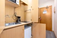 Kuchyň nebo kuchyňský kout v ubytování Apartamentos DV