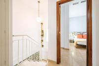 A bed or beds in a room at HomeySeville-Preciosa Casa Independiente Alfalfa, Parking Optional