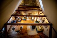 an overhead view of a living room with wooden floors at Studio Loft Murau - im Herzen der Altstadt in Murau