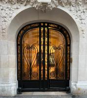 a black gate on the side of a building at [New] Eiffel tower view studio &#47; Paris Étoile in Paris