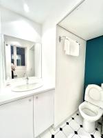 a bathroom with a white sink and a toilet at [New] Eiffel tower view studio &#47; Paris Étoile in Paris