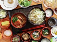 a table with bowls of food on a table at Dormy Inn EXPRESS Asakusa in Tokyo