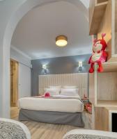 Łóżko lub łóżka w pokoju w obiekcie Hôtel L'Orée des plages