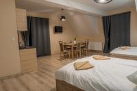 Łóżko lub łóżka w pokoju w obiekcie Apartamenty Na Rozstaju
