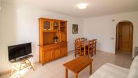 A television and/or entertainment centre at Primera línea Playa Cargador - Playamar 1121 - ALBERT VILLAS