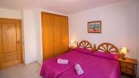 A bed or beds in a room at Primera línea Playa Cargador - Playamar 1121 - ALBERT VILLAS