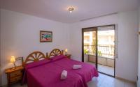A bed or beds in a room at Primera línea Playa Cargador - Playamar 1121 - ALBERT VILLAS