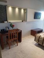 Posteľ alebo postele v izbe v ubytovaní Eleftheria Hotel