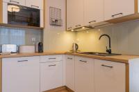 Kuchyňa alebo kuchynka v ubytovaní Apartamenty KAPRYS - Centrum