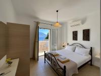 Posteľ alebo postele v izbe v ubytovaní Villa Eros Spartia Kefalonia
