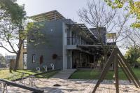 a house with a playground in front of it at 輕塵別院Serenegray B&amp;B in Wujie