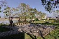 a playground with a wooden swing set in a park at 輕塵別院Serenegray B&amp;B in Wujie