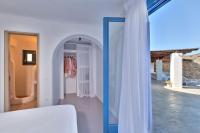 A bed or beds in a room at Lkm 4 Bed Villa Air Panormos Mykonos
