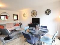 a living room with a table and chairs at Appartement Les Gets, 3 pièces, 4 personnes - FR-1-623-292 in Les Gets