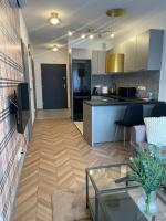 Kuchyňa alebo kuchynka v ubytovaní Apartament przy Karmelu