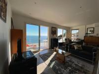 a living room with a view of the ocean at Vue mer.Tranquilité.Cap d&#39;Ail à 10 mn de MONACO in Cap d&#39;Ail