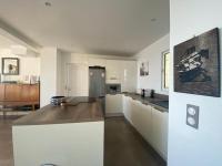 a kitchen with white cabinets and a counter top at Vue mer.Tranquilité.Cap d&#39;Ail à 10 mn de MONACO in Cap d&#39;Ail