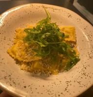 een bord met pasta en groenten erop bij Red Lion Coaching Inn in Ellesmere