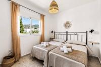 A bed or beds in a room at Villa El Algarrobo