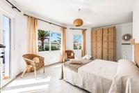 A bed or beds in a room at Villa El Algarrobo