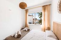 A bed or beds in a room at Villa El Algarrobo