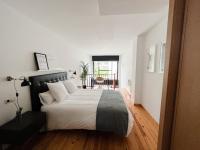 Postel nebo postele na pokoji v ubytování Apartamentos Ciudad Santiago