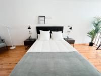 Postel nebo postele na pokoji v ubytování Apartamentos Ciudad Santiago